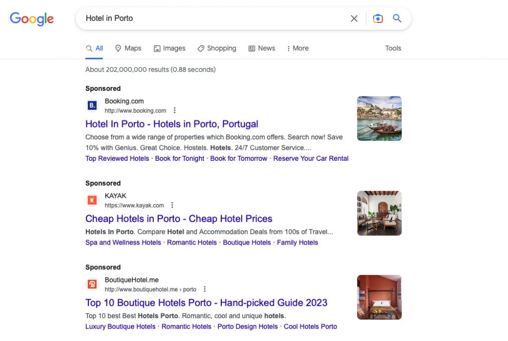 Screenshot of the Google search engine results page (SERP) showing the paid results section at the top of the page, identified as sponsored listings, for the search "Hotel in Porto". 